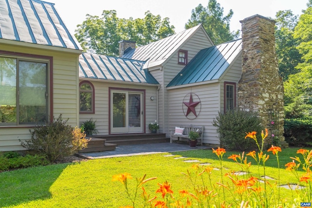 7122 Harris Mountain Ln, Dyke, VA 22935 - rear view of property featuring a standing seam roof, a metal roof, a chimney, and a lawn