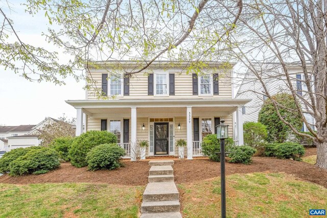colonial-style house with a porch