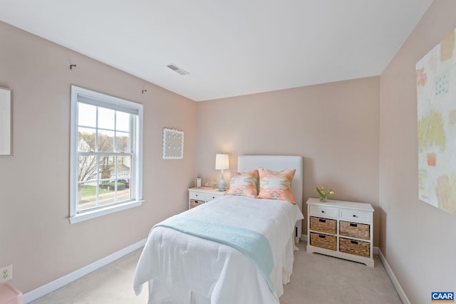 bedroom with light carpet, baseboards, and visible vents