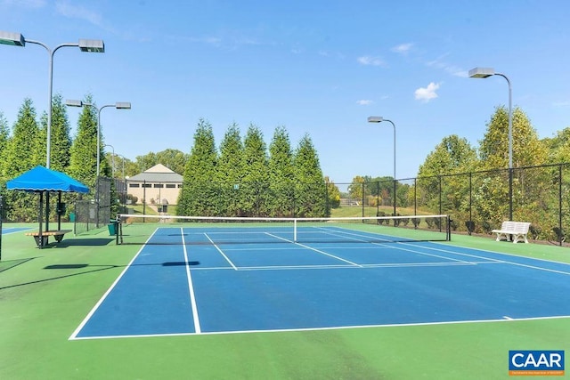 view of sport court featuring fence and community basketball court