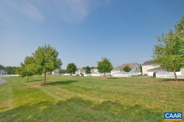 view of yard with fence and a residential view