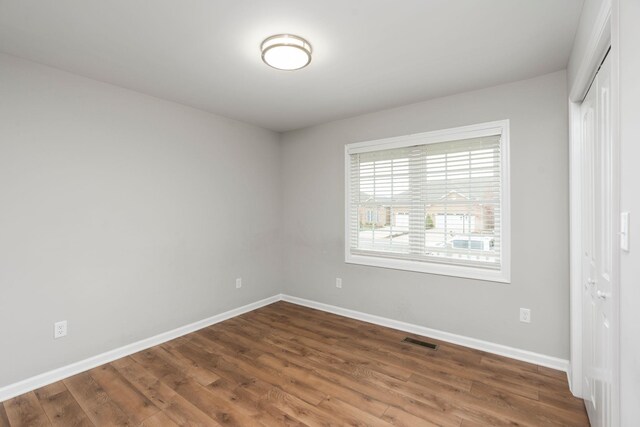 121 Lake View Cir, Waynesboro, VA 22980 - unfurnished bedroom featuring a closet, wood finished floors, visible vents, and baseboards