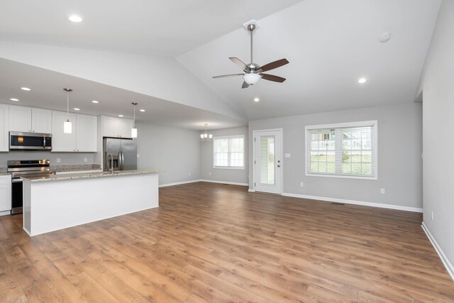 121 Lake View Cir, Waynesboro, VA 22980 - kitchen featuring ceiling fan with notable chandelier, stainless steel appliances, open floor plan, white cabinets, and light wood-style floors