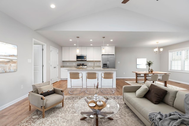 121 Lake View Cir, Waynesboro, VA 22980 - living area featuring ceiling fan with notable chandelier, baseboards, light wood-style floors, vaulted ceiling, and recessed lighting