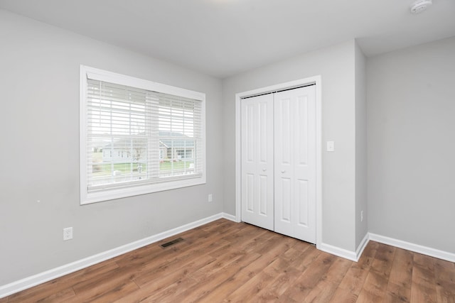 121 Lake View Cir, Waynesboro, VA 22980 - unfurnished bedroom featuring a closet, visible vents, baseboards, and light wood-style flooring