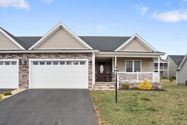 121 Lake View Cir, Waynesboro, VA 22980 - view of front facade with driveway, covered porch, a garage, roof with shingles, and a front lawn