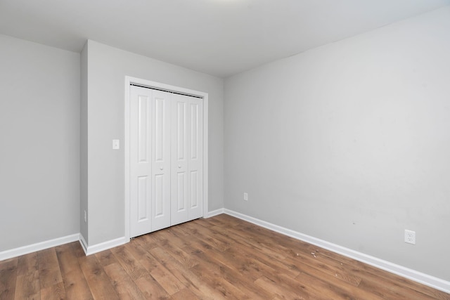 121 Lake View Cir, Waynesboro, VA 22980 - unfurnished bedroom with a closet, wood finished floors, and baseboards