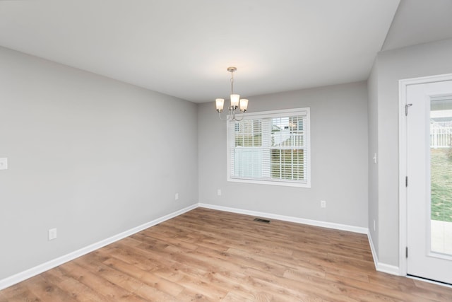 121 Lake View Cir, Waynesboro, VA 22980 - unfurnished dining area featuring light wood finished floors, a notable chandelier, baseboards, and a healthy amount of sunlight