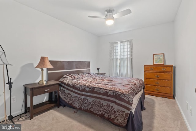  - carpeted bedroom featuring baseboards and ceiling fan
