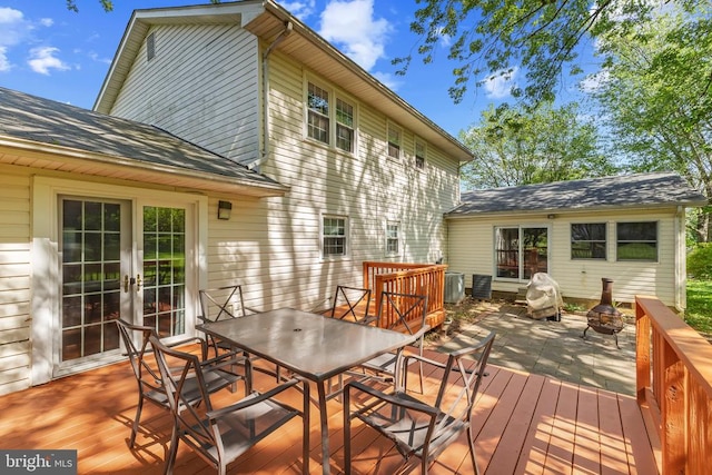  - wooden deck featuring french doors and outdoor dining area