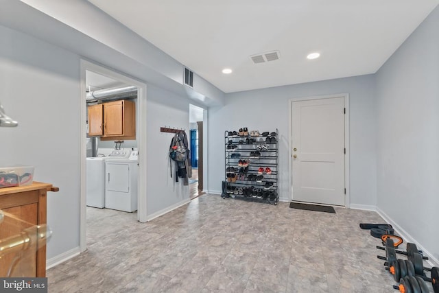  - workout area featuring washing machine and clothes dryer, baseboards, and recessed lighting