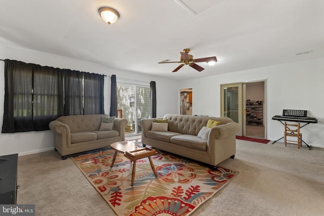  - living room featuring carpet floors, ceiling fan, and baseboards