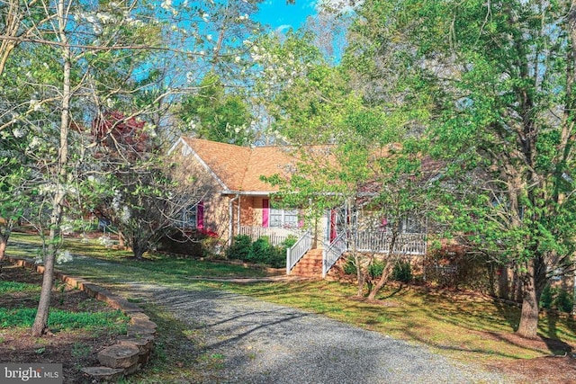 135 Bluewater Blvd S, Mineral, VA 23117 - obstructed view of property featuring covered porch and driveway