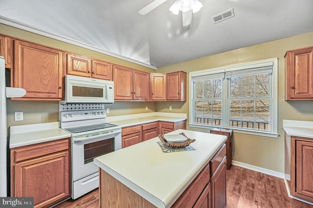 135 Bluewater Blvd S, Mineral, VA 23117 - kitchen with white appliances, ceiling fan, light countertops, lofted ceiling, and dark wood-type flooring