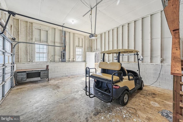 135 Bluewater Blvd S, Mineral, VA 23117 - garage featuring concrete block wall, a garage door opener, and electric panel