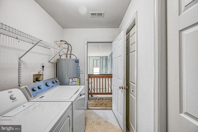 135 Bluewater Blvd S, Mineral, VA 23117 - laundry room featuring water heater, washer and dryer, and light colored carpet