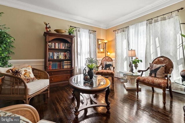  - living area with ornamental molding, wainscoting, and wood-type flooring
