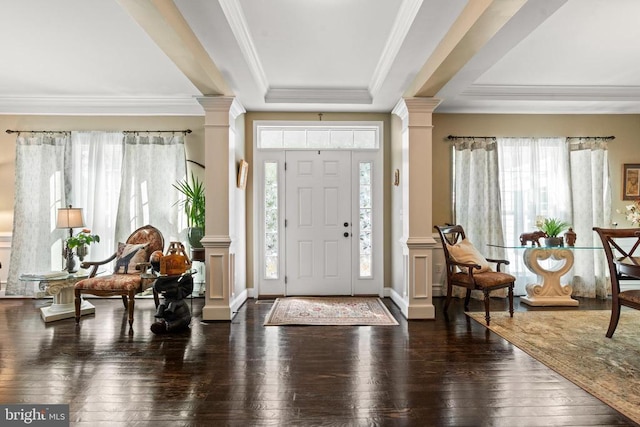  - entryway featuring decorative columns, wood-type flooring, crown molding, and a raised ceiling