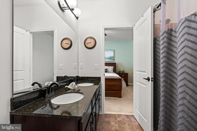  - full bath featuring double vanity and connected bathroom