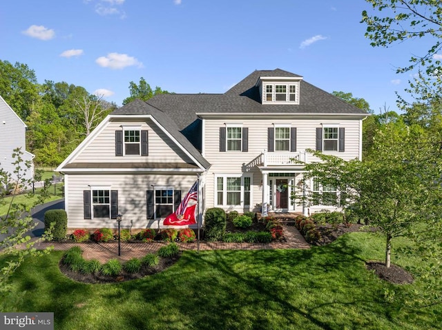  - view of front facade featuring a front lawn
