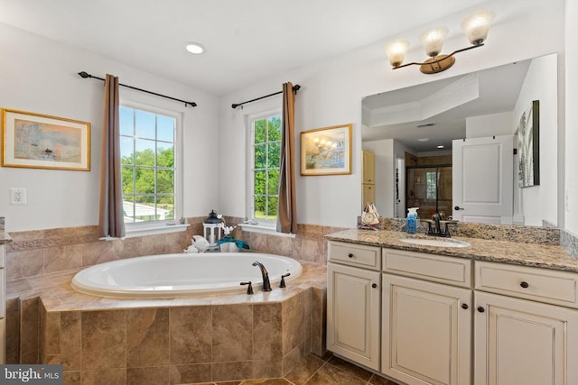  - full bathroom with vanity, a bath, a shower stall, and recessed lighting