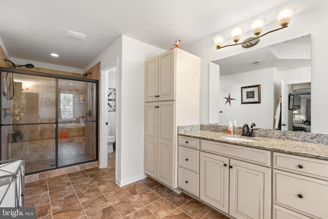  - bathroom featuring vanity, a stall shower, recessed lighting, and tile patterned flooring