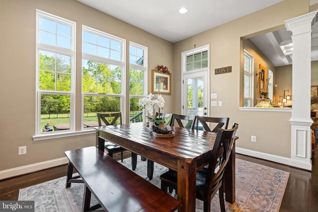  - dining space featuring decorative columns, wood finished floors, and recessed lighting