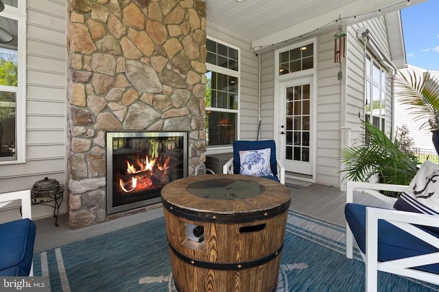  - wooden porch with an outdoor stone fireplace
