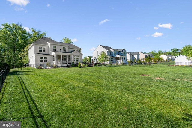  - fenced backyard featuring a residential view