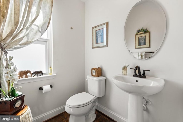  - bathroom with baseboards and wood finished floors