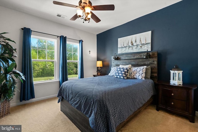  - carpeted bedroom featuring baseboards and ceiling fan