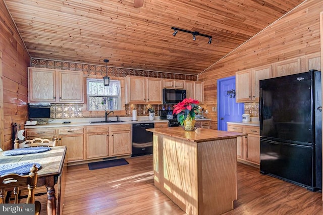 kitchen featuring black appliances, pendant lighting, light brown cabinets, a kitchen island, and sink