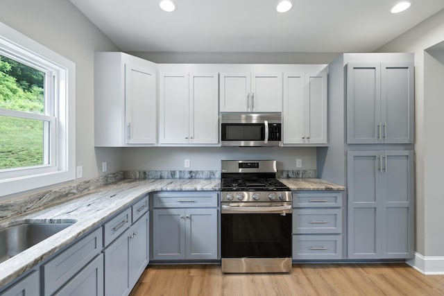 43 Mcilwee Ln, Staunton, VA 24401 - kitchen with stainless steel appliances, light wood-style floors, recessed lighting, light stone countertops, and white cabinets