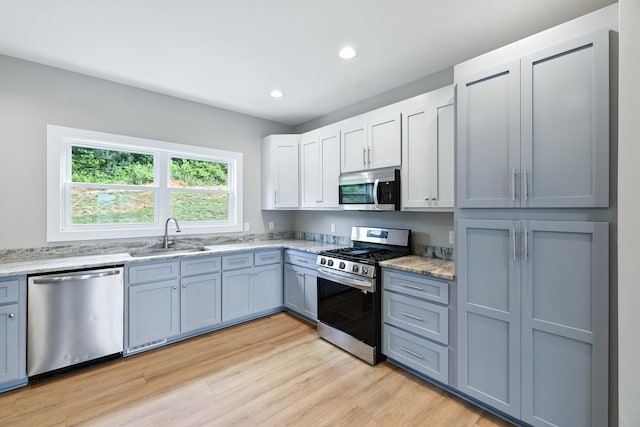 43 Mcilwee Ln, Staunton, VA 24401 - kitchen with appliances with stainless steel finishes, light wood-style floors, recessed lighting, light stone countertops, and white cabinets