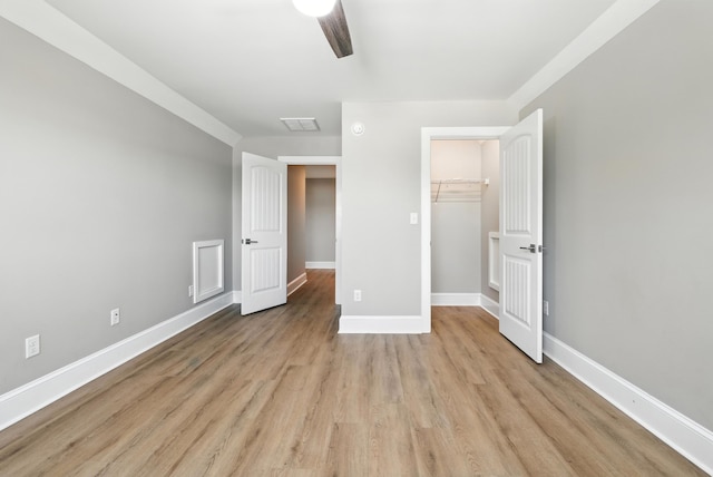 43 Mcilwee Ln, Staunton, VA 24401 - unfurnished bedroom featuring light wood-type flooring, a ceiling fan, and a closet