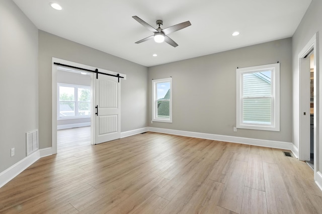 43 Mcilwee Ln, Staunton, VA 24401 - spare room with ceiling fan, a barn door, light wood-style flooring, and recessed lighting