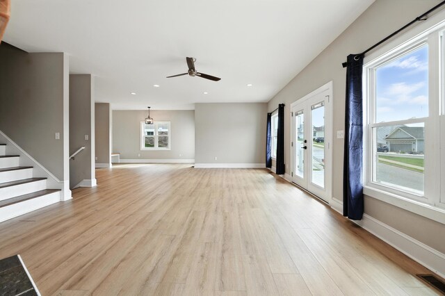 43 Mcilwee Ln, Staunton, VA 24401 - unfurnished living room with light wood finished floors, healthy amount of natural light, ceiling fan, recessed lighting, and stairway