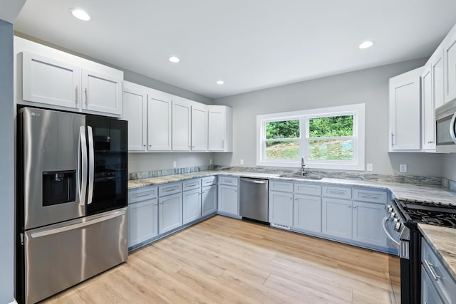 43 Mcilwee Ln, Staunton, VA 24401 - kitchen featuring stainless steel appliances, recessed lighting, light stone counters, light wood finished floors, and white cabinets
