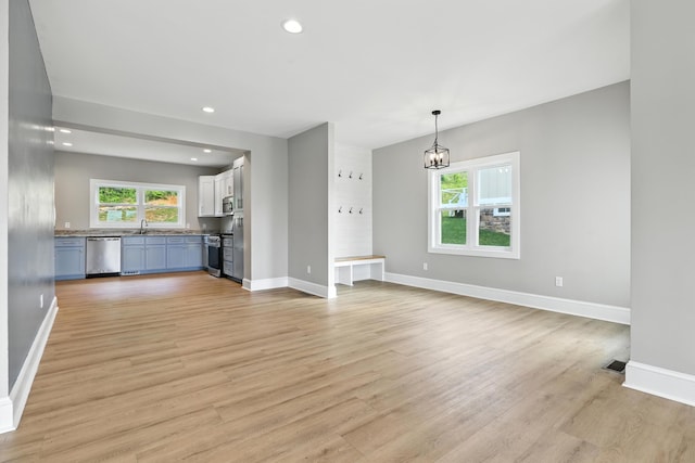 43 Mcilwee Ln, Staunton, VA 24401 - unfurnished living room featuring light wood-style flooring, recessed lighting, and a chandelier