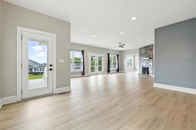 43 Mcilwee Ln, Staunton, VA 24401 - unfurnished living room featuring light wood-type flooring, recessed lighting, ceiling fan, and a stone fireplace