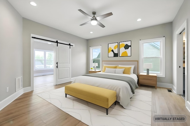 43 Mcilwee Ln, Staunton, VA 24401 - bedroom with a barn door, light wood-type flooring, recessed lighting, and ceiling fan