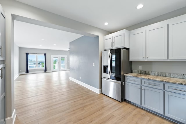 43 Mcilwee Ln, Staunton, VA 24401 - kitchen featuring stainless steel refrigerator with ice dispenser, light wood-style flooring, recessed lighting, light stone countertops, and open floor plan