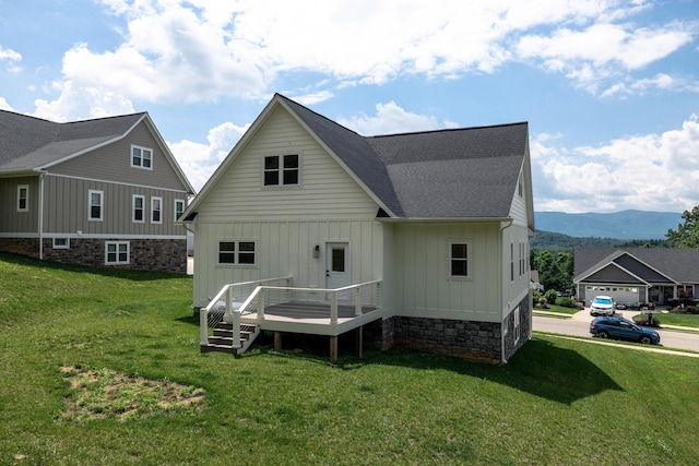 43 Mcilwee Ln, Staunton, VA 24401 - back of house featuring board and batten siding, a deck with mountain view, a shingled roof, and a lawn