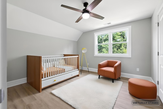 43 Mcilwee Ln, Staunton, VA 24401 - bedroom with wood finished floors, lofted ceiling, a nursery area, and a ceiling fan