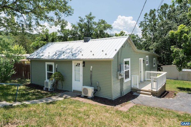 1805 Shenandoah Ave, Waynesboro, VA 22980 - rear view of house featuring a wooden deck, a metal roof, and an outbuilding