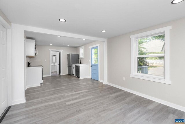 1805 Shenandoah Ave, Waynesboro, VA 22980 - unfurnished living room with light wood-style flooring and recessed lighting