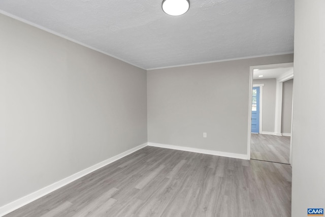 1805 Shenandoah Ave, Waynesboro, VA 22980 - unfurnished room with wood finished floors, a textured ceiling, and crown molding