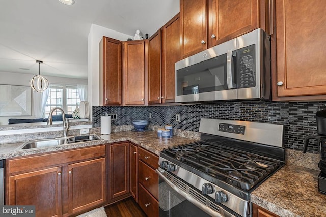 2015 Elm Tree Ct, Charlottesville, VA 22911 - kitchen with stainless steel appliances, tasteful backsplash, brown cabinetry, and dark stone counters