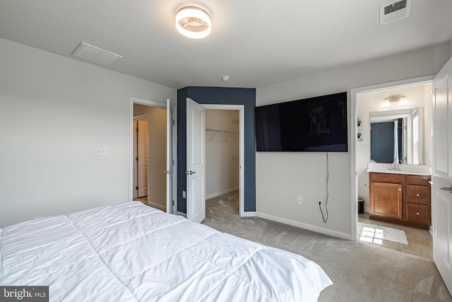 2015 Elm Tree Ct, Charlottesville, VA 22911 - bedroom with light carpet, a walk in closet, a closet, and connected bathroom