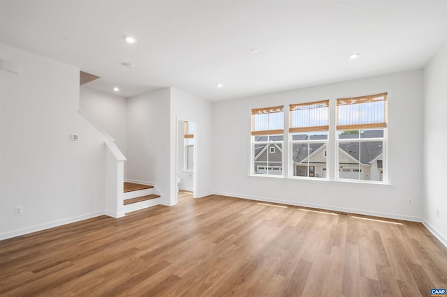 4454 Alston St, Crozet, VA 22932 - unfurnished room featuring stairway, light wood-style flooring, and recessed lighting